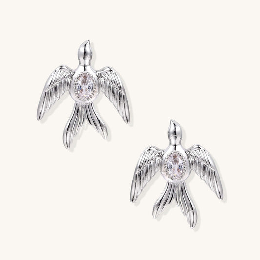 Phoenix Studs in silver-tone, featuring sculptural wings and shimmering zirconia accents.