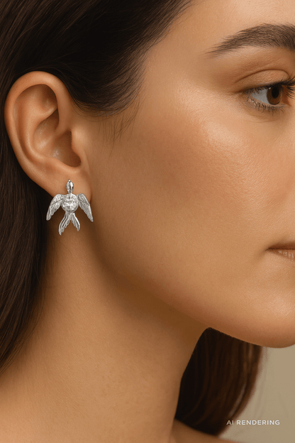 Phoenix Studs featuring radiant crystal wings worn by a model, showcasing bold transformation and elegance.