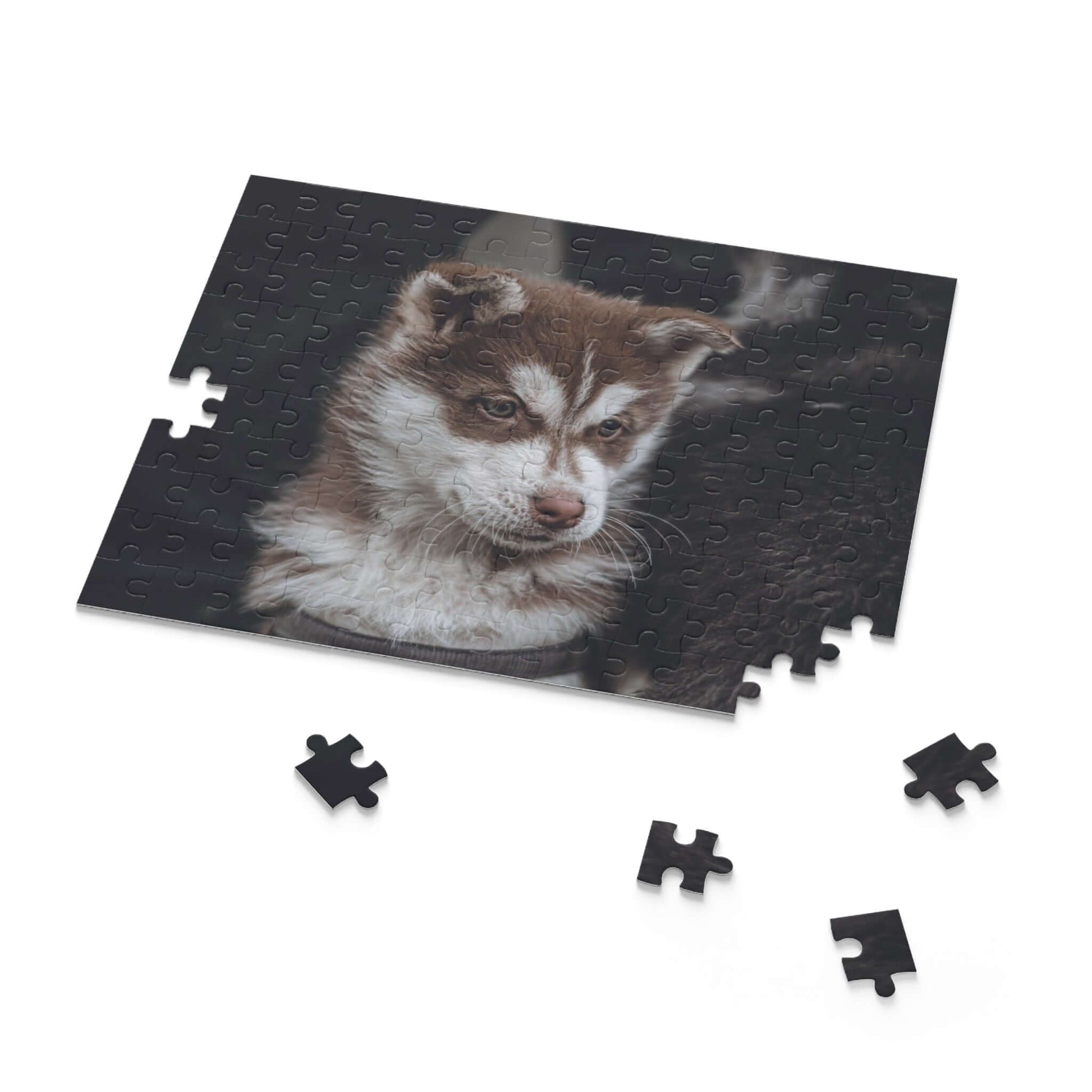 Custom puzzle featuring a cute puppy photo with missing pieces for a fun family activity.