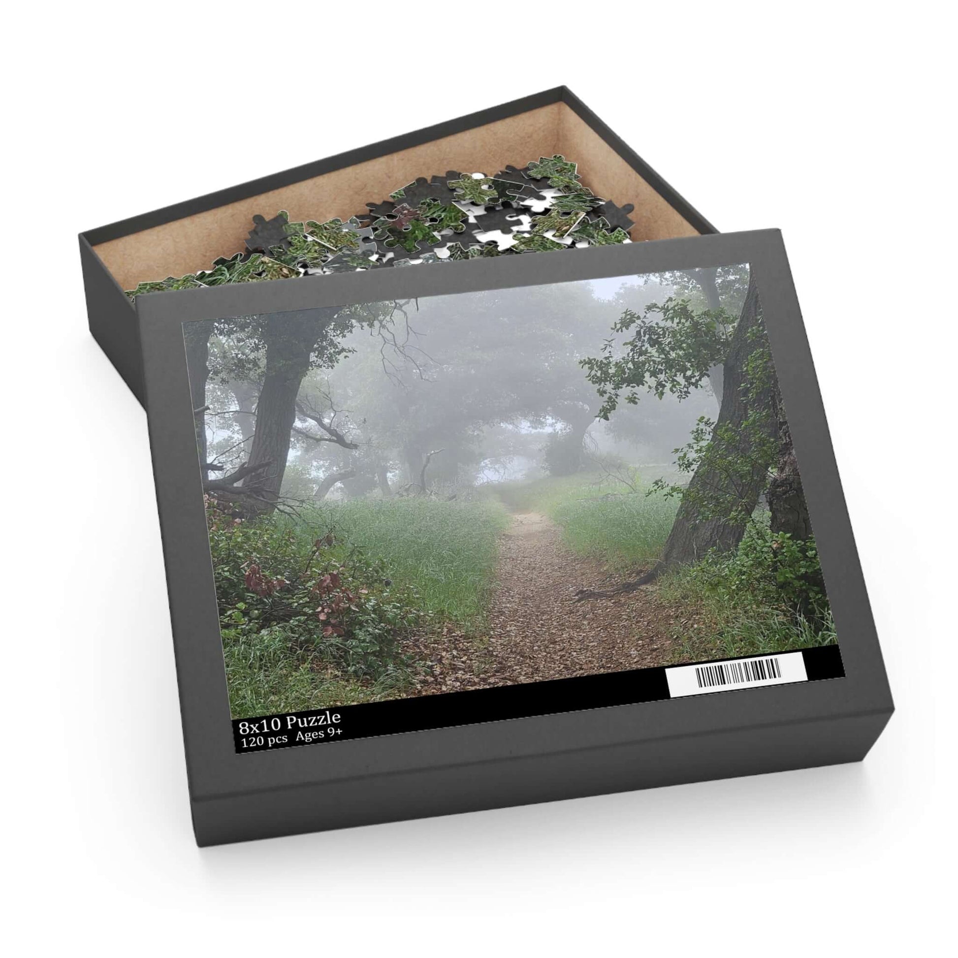 Custom puzzle box with chipboard pieces featuring a peaceful foggy path scene, perfect for family fun.