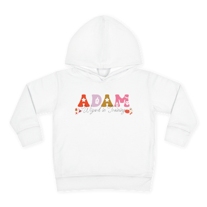 Spooky Toddler Hoodie – Personalized Halloween Pullover for Your Little Boo featuring "ADAM Wizard in Training" design.