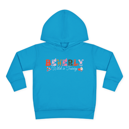 Spooky Toddler Hoodie – Personalized Halloween Pullover for Your Little Boo featuring a blue design with the name Beverly.