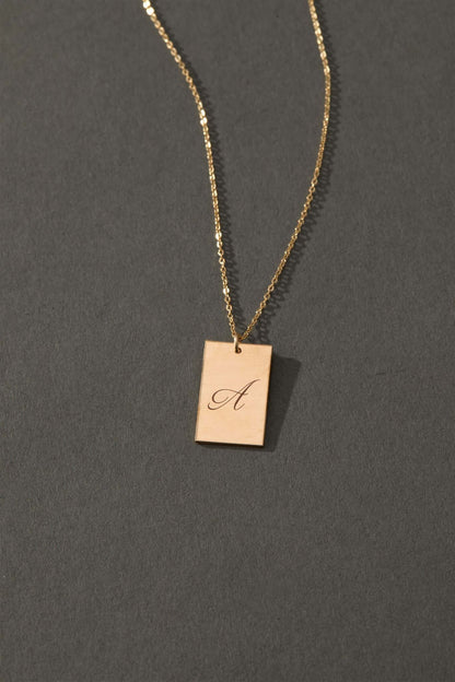 Stella Gold Initial Necklace – Personalized 14k Gold-Filled Pendant featuring a delicate engraved pendant with letter A.