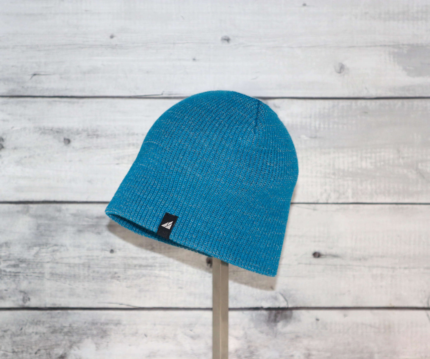 Toddler Acrylic Beanie – Soft Stretch Hat for Ages 1–3 displayed on a stand, vibrant blue color.