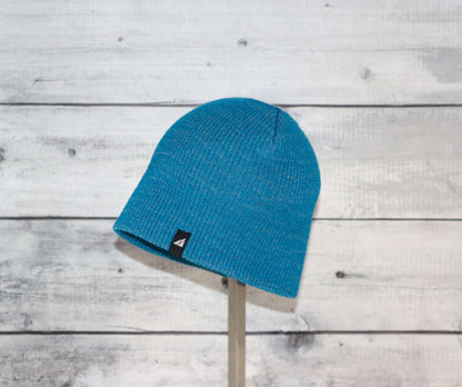 Toddler Acrylic Beanie – Soft Stretch Hat for Ages 1–3 displayed on a stand, vibrant blue color.