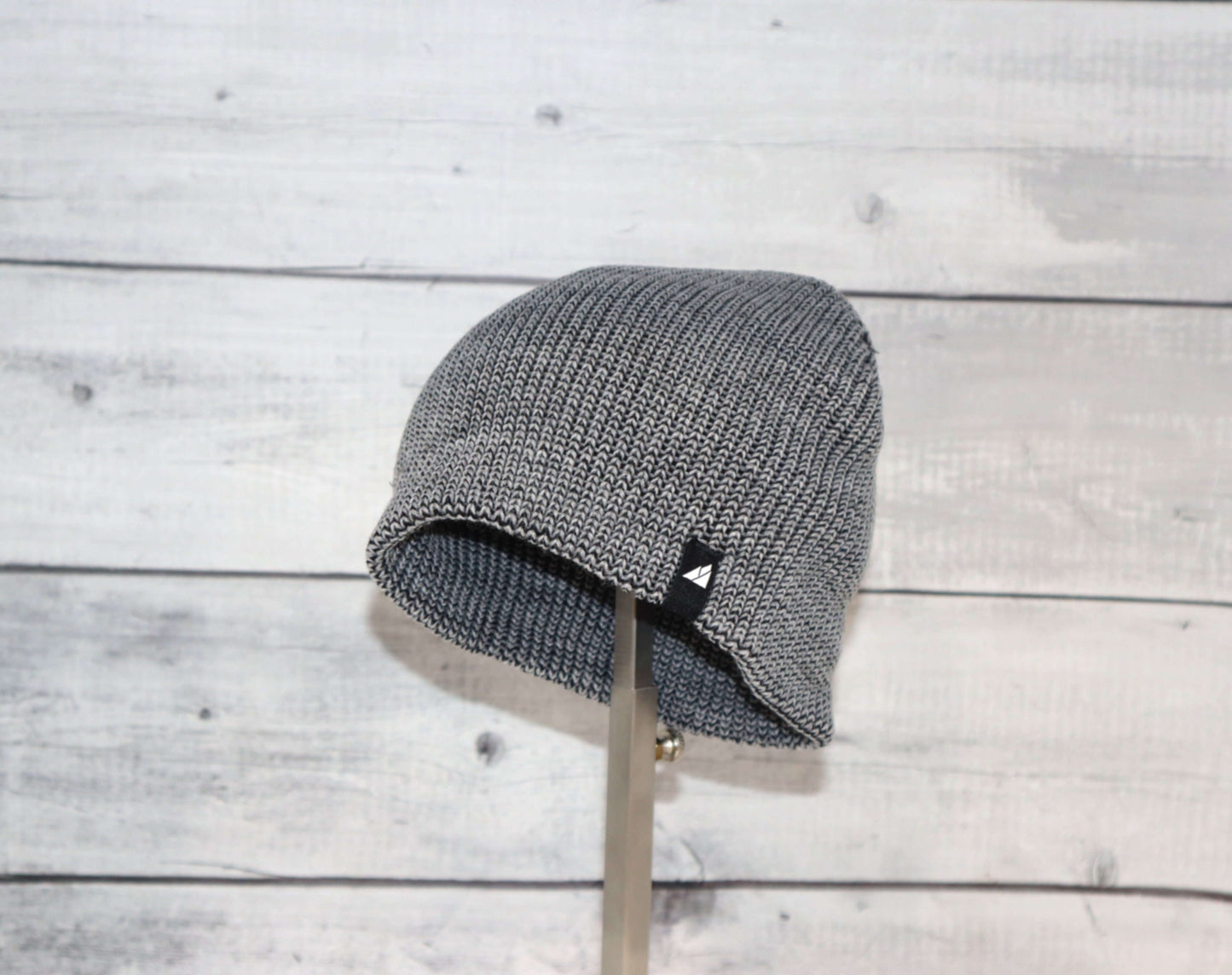 Toddler Acrylic Beanie – Soft Stretch Hat for Ages 1–3 displayed on a stand, showcasing its cozy knit design.