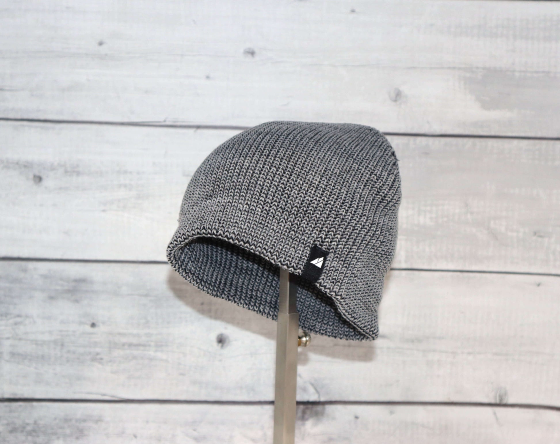 Toddler Acrylic Beanie – Soft Stretch Hat for Ages 1–3 displayed on a stand, showcasing its cozy knit design.