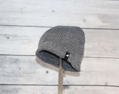 Toddler Acrylic Beanie – Soft Stretch Hat for Ages 1–3 displayed on a stand, showcasing its cozy knit design.