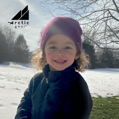 Toddler Acrylic Beanie – Soft Stretch Hat for Ages 1–3 worn by a smiling child in a snowy outdoor setting.