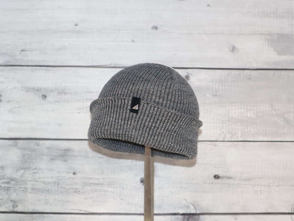 Image of Toddler Acrylic Cuff Hat – Soft Knit Beanie on display, showcasing its cozy knit design and cuff.