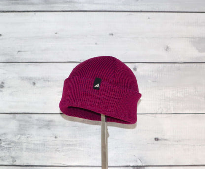 Toddler Acrylic Cuff Hat – Soft Knit Beanie displayed on a wooden background, showcasing its snug design and vibrant color.