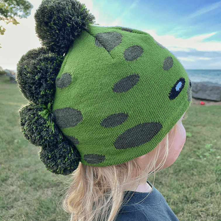 Toddler Specialty Hat – Animal-Inspired Warmth with Purpose featuring a playful dinosaur design in green.