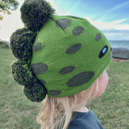 Toddler Specialty Hat – Animal-Inspired Warmth with Purpose featuring a playful dinosaur design in green.