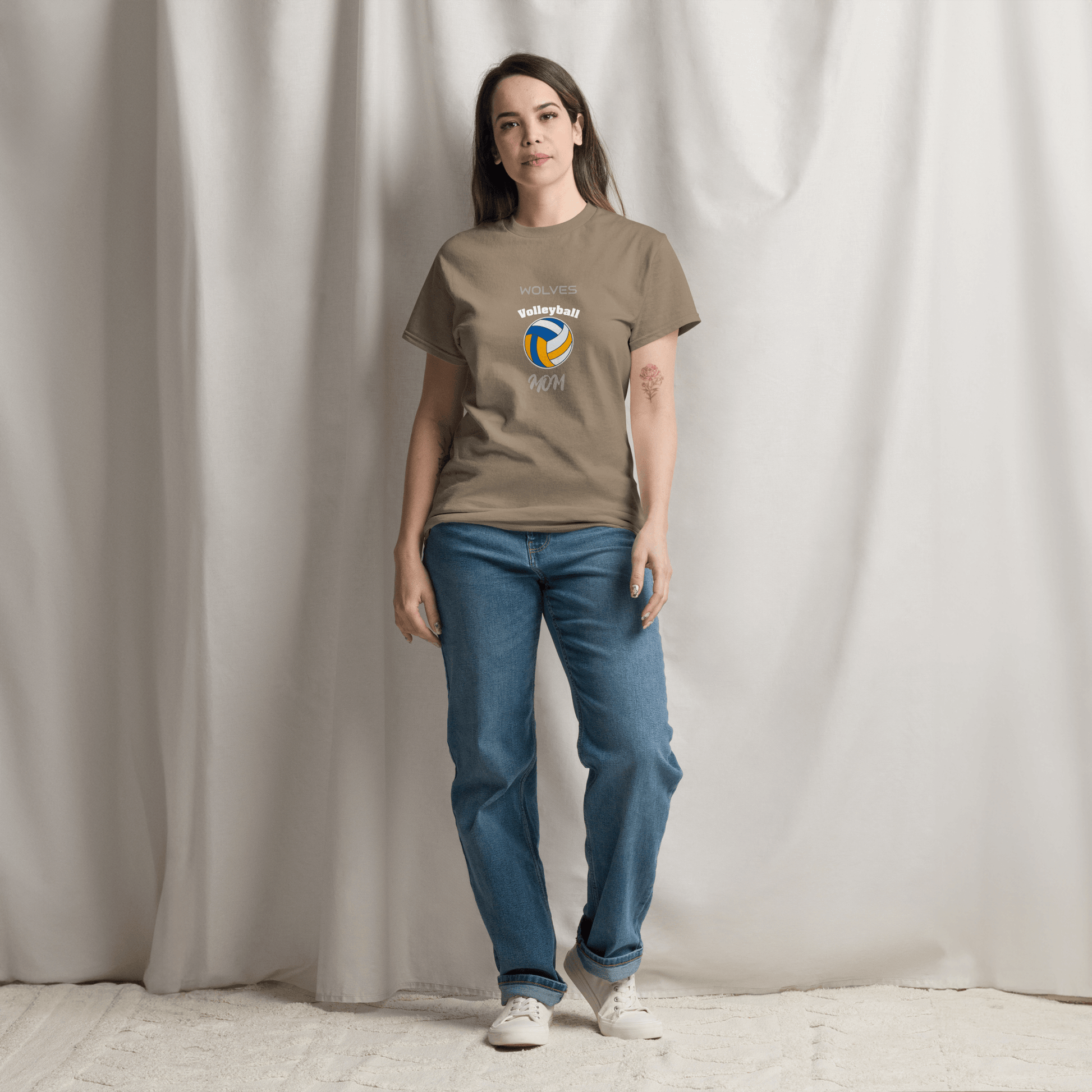 Custom volleyball parent tee worn by a woman, featuring a volleyball graphic and text for game day support.