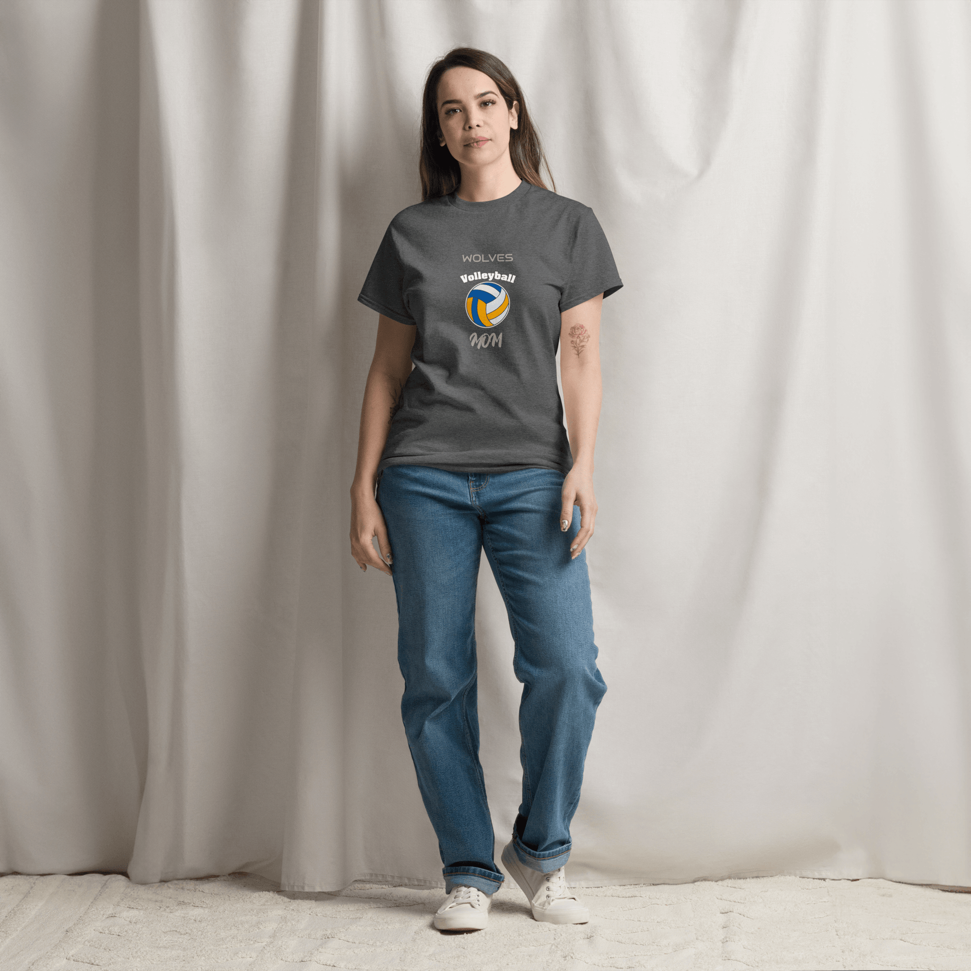 Woman wearing a custom gray volleyball parent tee, showcasing team spirit and comfort for game day support.