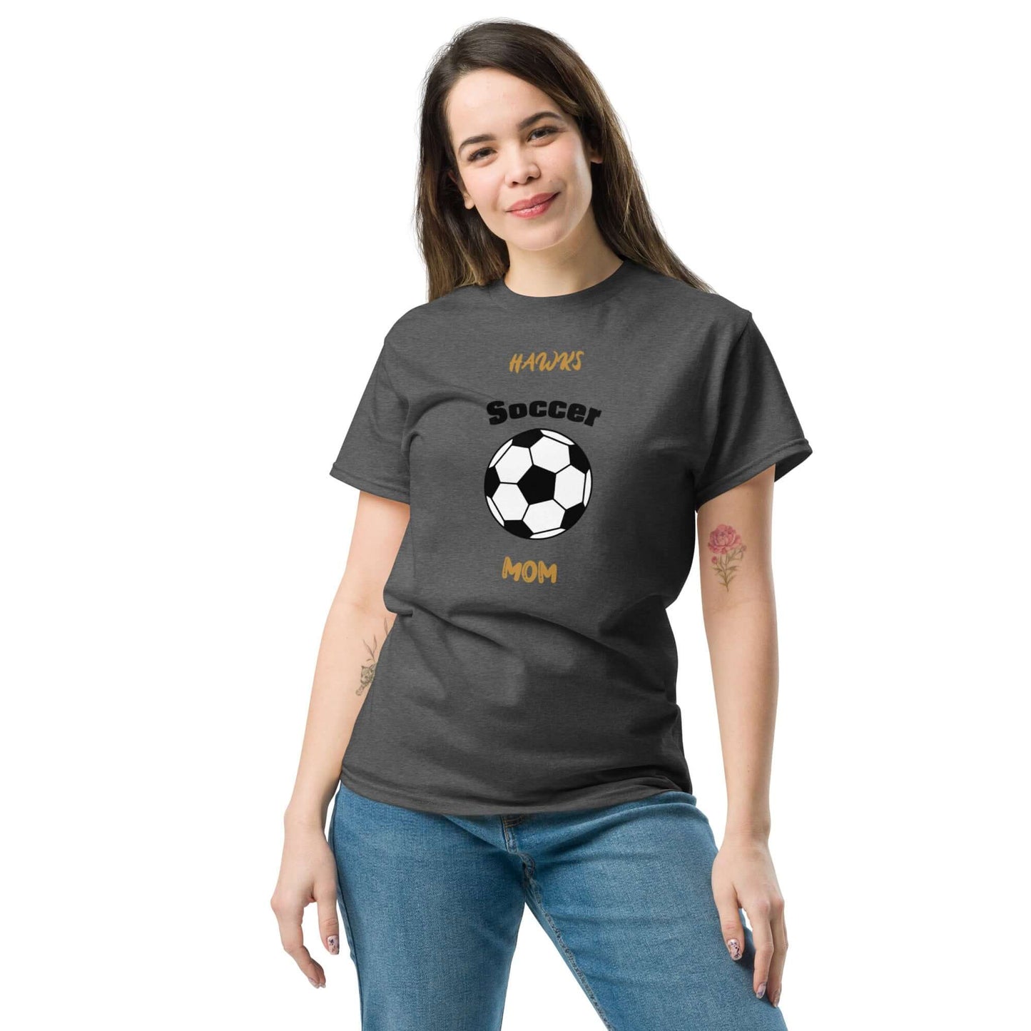 Smiling woman wearing a gray Soccer Mom t-shirt with a soccer ball graphic, perfect for proud soccer parents.