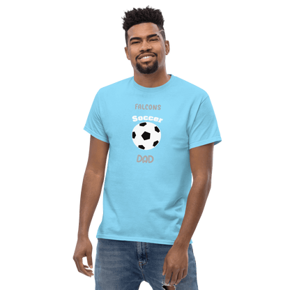 Custom soccer dad tee in light blue, featuring soccer ball graphic and 'Falcons' text, perfect for game day support.