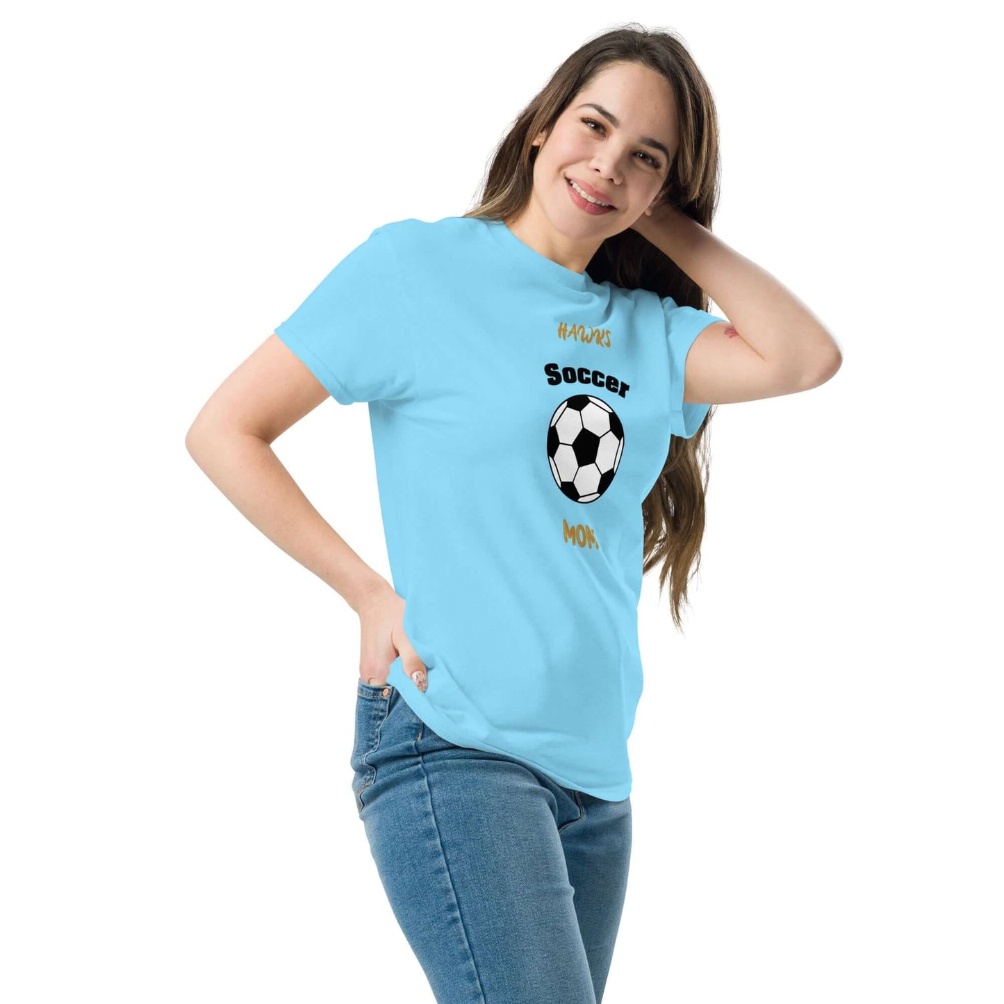 Cheerful woman wearing a light blue soccer mom tee with a soccer ball design, perfect for supporting youth teams.
