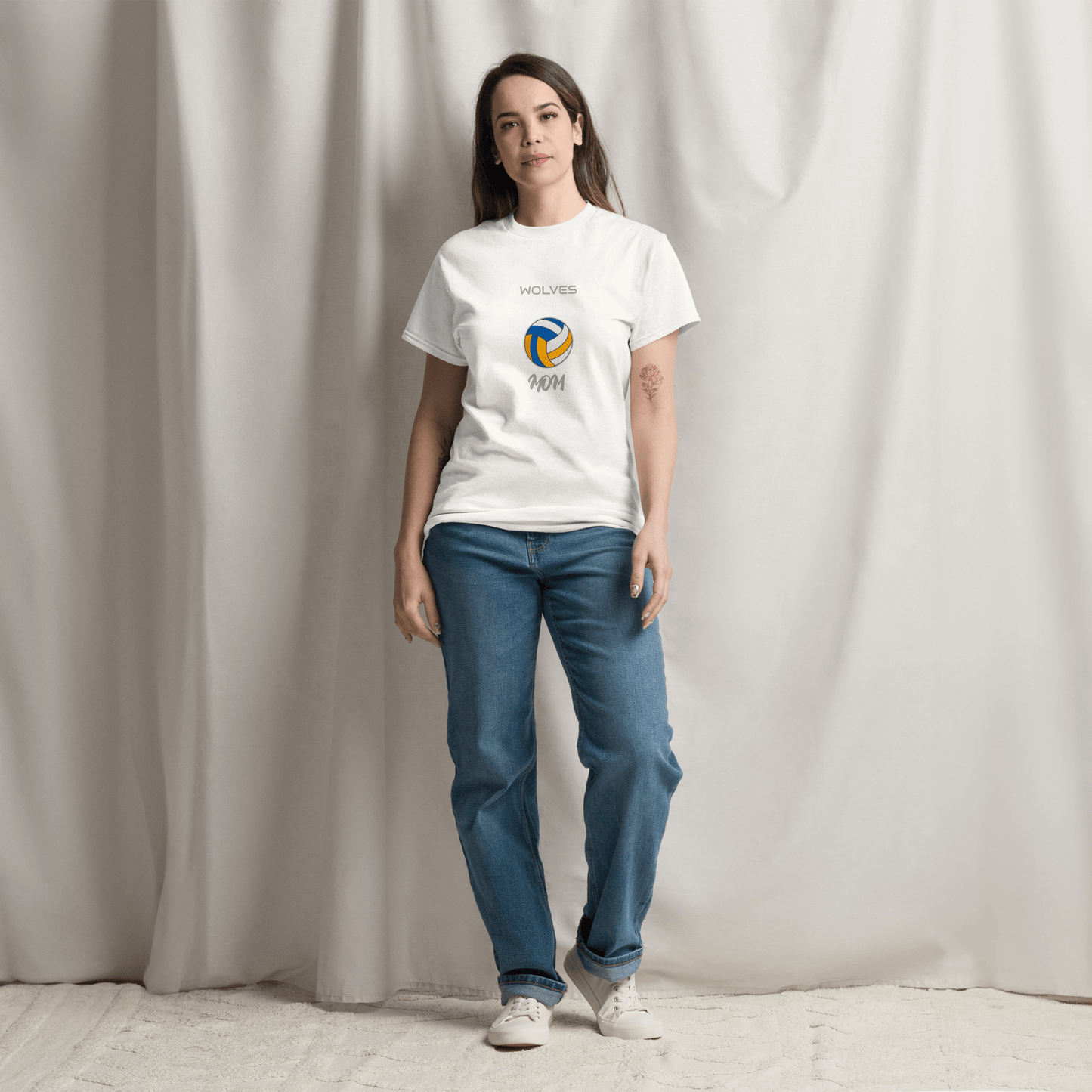 Woman wearing a custom volleyball parent tee with 'Wolves' design, showcasing game day spirit and style.