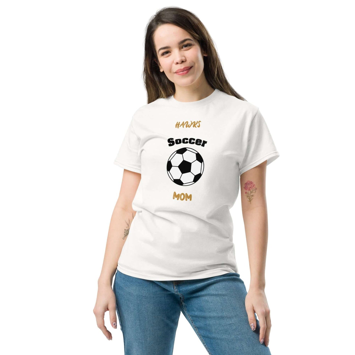 Woman wearing a white soccer mom tee featuring a soccer ball design, perfect for enthusiastic sports parents.