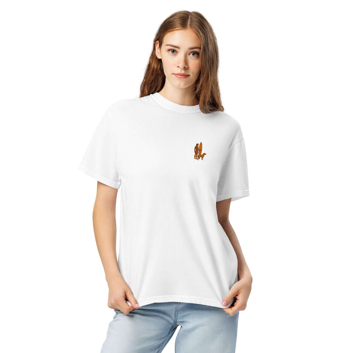 Model wearing a white heavyweight tee featuring a minimalist surfer-and-dog silhouette design.