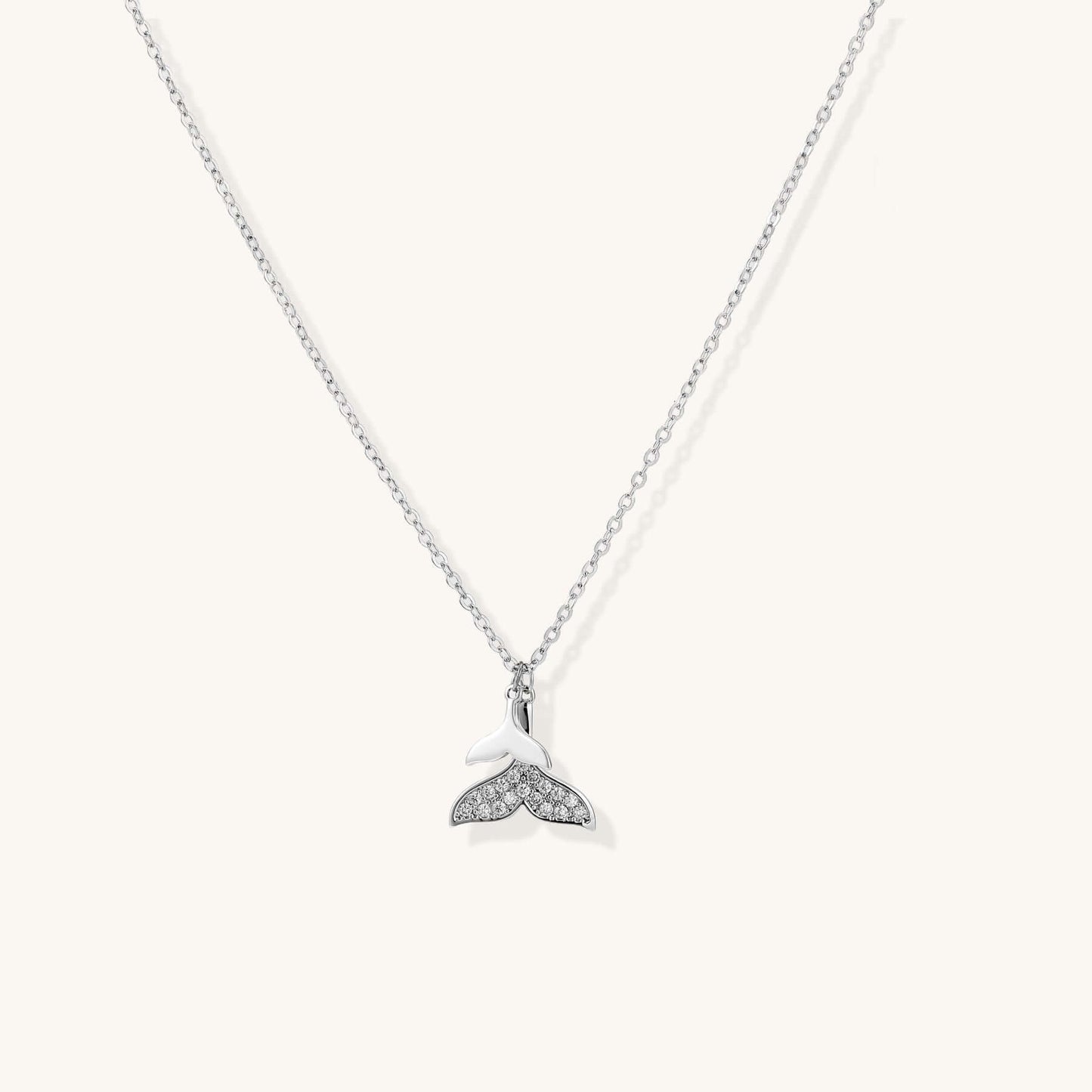 Whale Tail Crystal Necklace with sparkling crystals on a delicate chain, symbolizing ocean spirit and freedom.