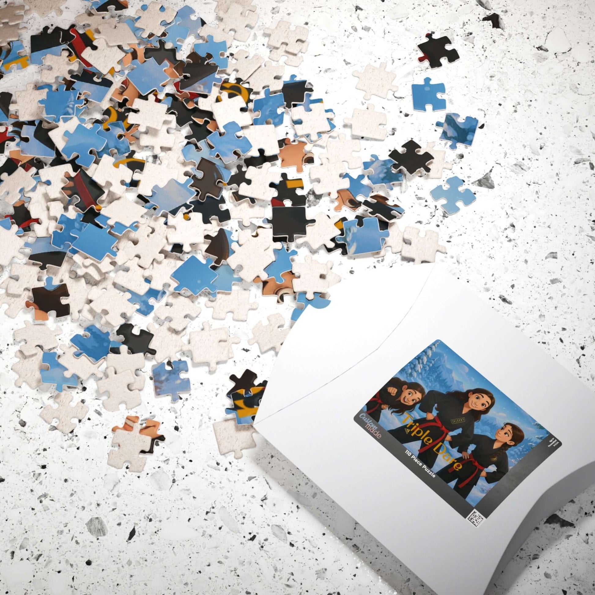 Winter Cartoon Puzzle – Personalized Disney-Style Keepsake pieces scattered with the printed puzzle box on a textured surface.