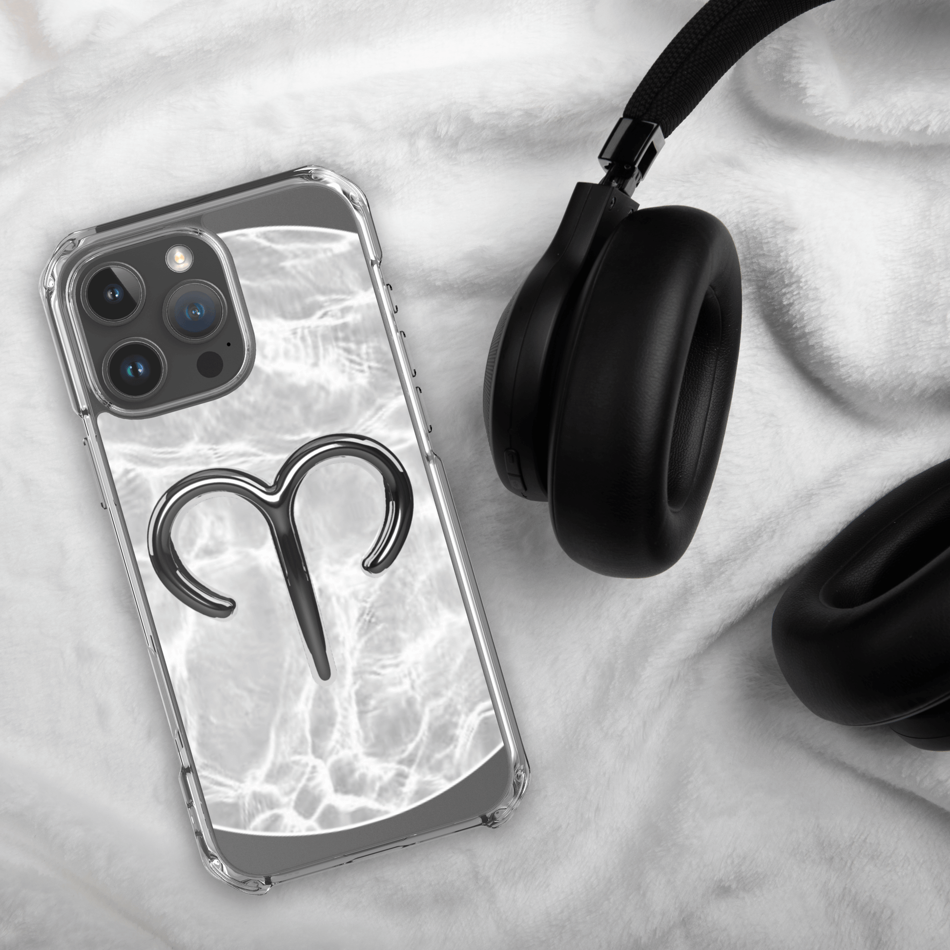 Zodiac Aries MagSafe clear iPhone case with metallic design on marble background, featuring raised bezels and sleek finish.