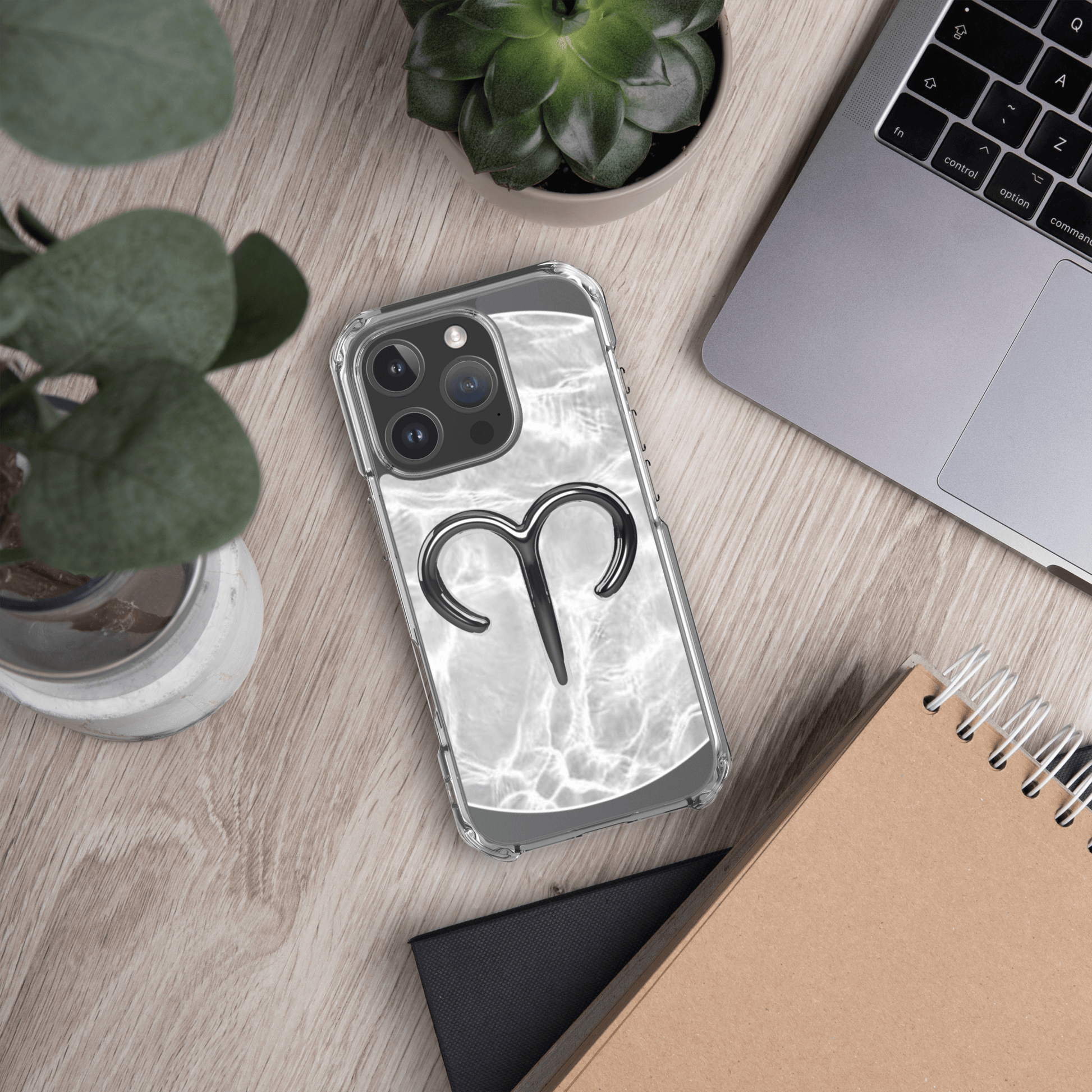 Zodiac Aries MagSafe clear iPhone case with metallic design on marble backdrop, showcasing cosmic style.