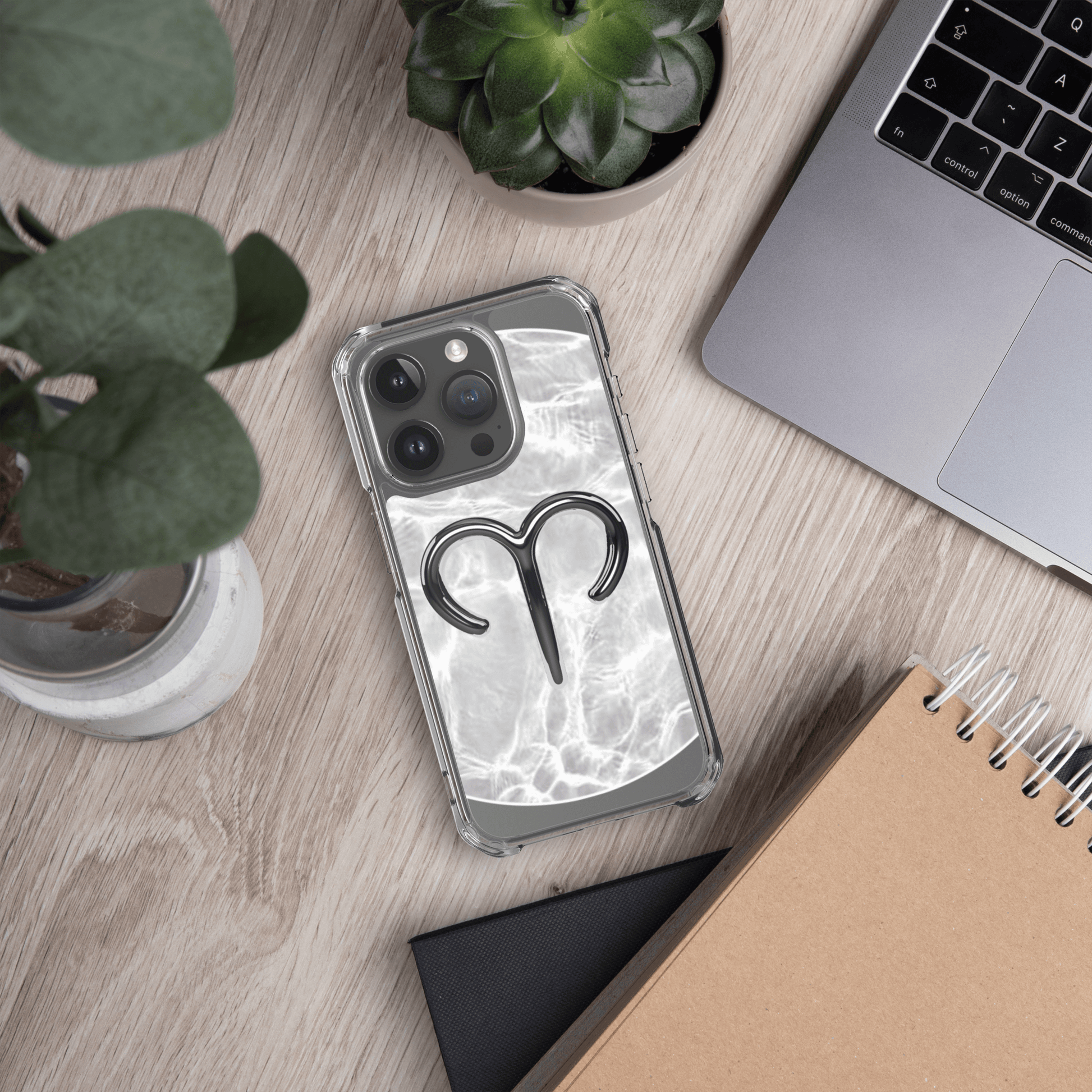 Zodiac Aries MagSafe clear iPhone case with metallic design on a marble background, showcasing lively personality.