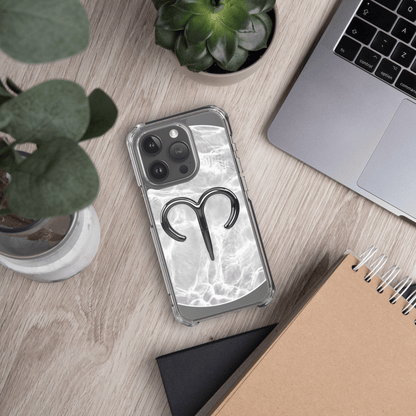 Zodiac Aries MagSafe clear iPhone case with metallic design on a marble background, showcasing lively personality.