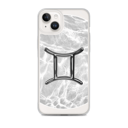Zodiac Gemini clear iPhone case with metallic design over marble background, offering stylish protection.