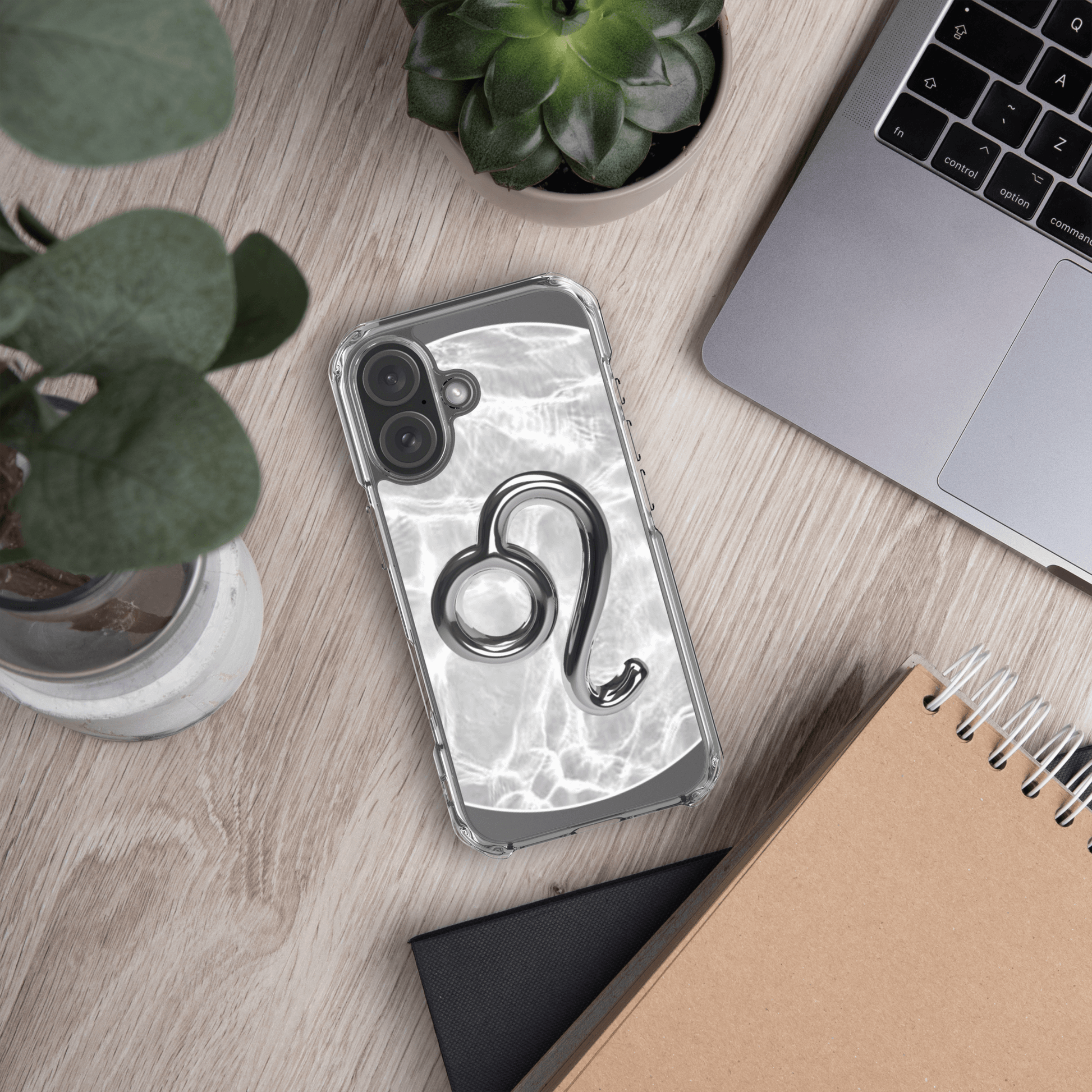Zodiac Leo Magsafe clear iPhone case with metallic design on marble background, perfect for cosmic style.