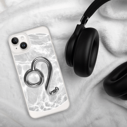 Zodiac Leo Magsafe clear iPhone case with metallic design on a soft background with headphones.