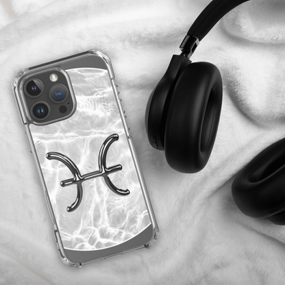 Zodiac Pisces Magsafe iPhone case with marble design on soft surface next to headphones.