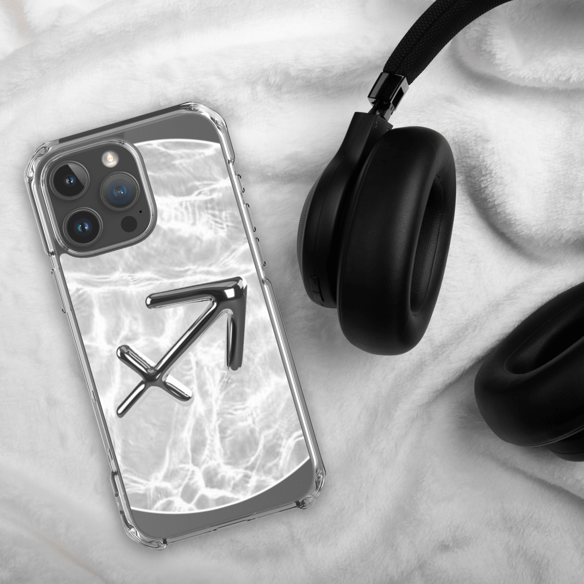 Zodiac Sagittarius Magsafe clear iPhone case with metallic design on marble background and headphones.