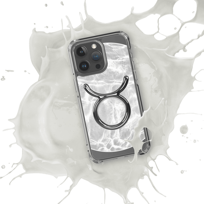 Zodiac Taurus MagSafe clear iPhone case with metallic design over marble pattern, showcasing cosmic style and protection.