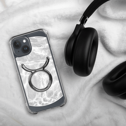 Zodiac Taurus MagSafe iPhone case on soft fabric with headphones, showcasing a marble metallic design.