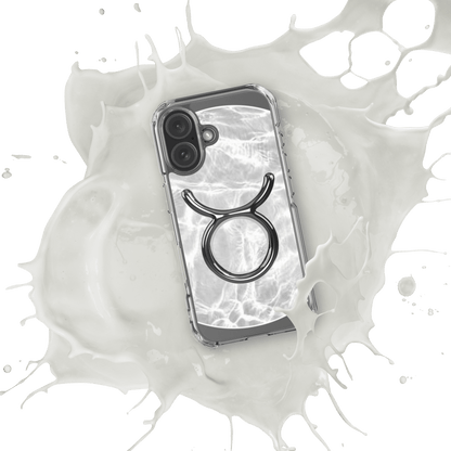 Zodiac Taurus Magsafe clear iPhone case with metallic design over marble-inspired texture.